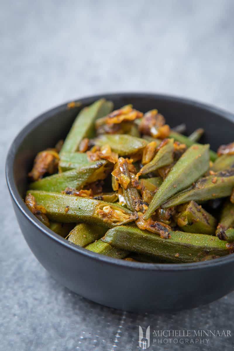 Bhindi ki Sabzi - a bowl of fried green okra upclose