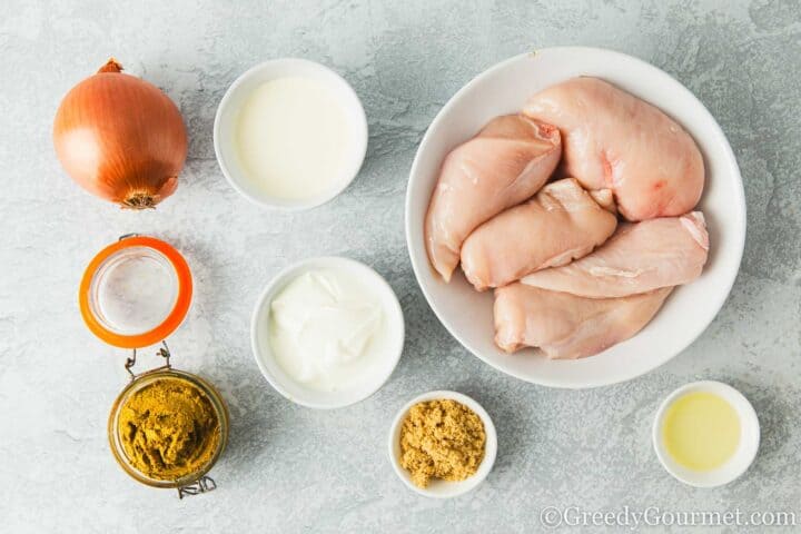 Ingredients for chicken korma on a table.