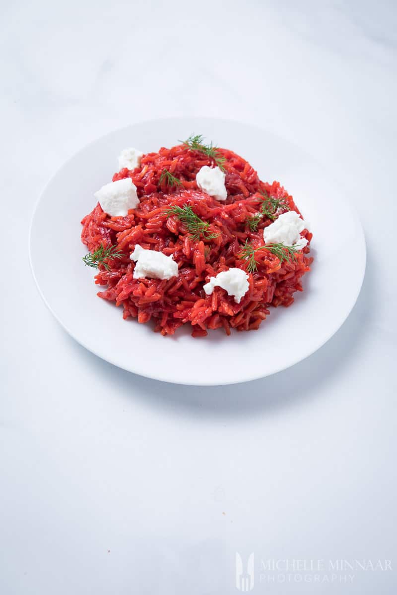 Beetroot risotto with cheese.