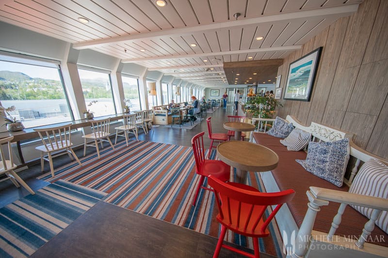 The interior of hurtigruten ship, white and red chairs