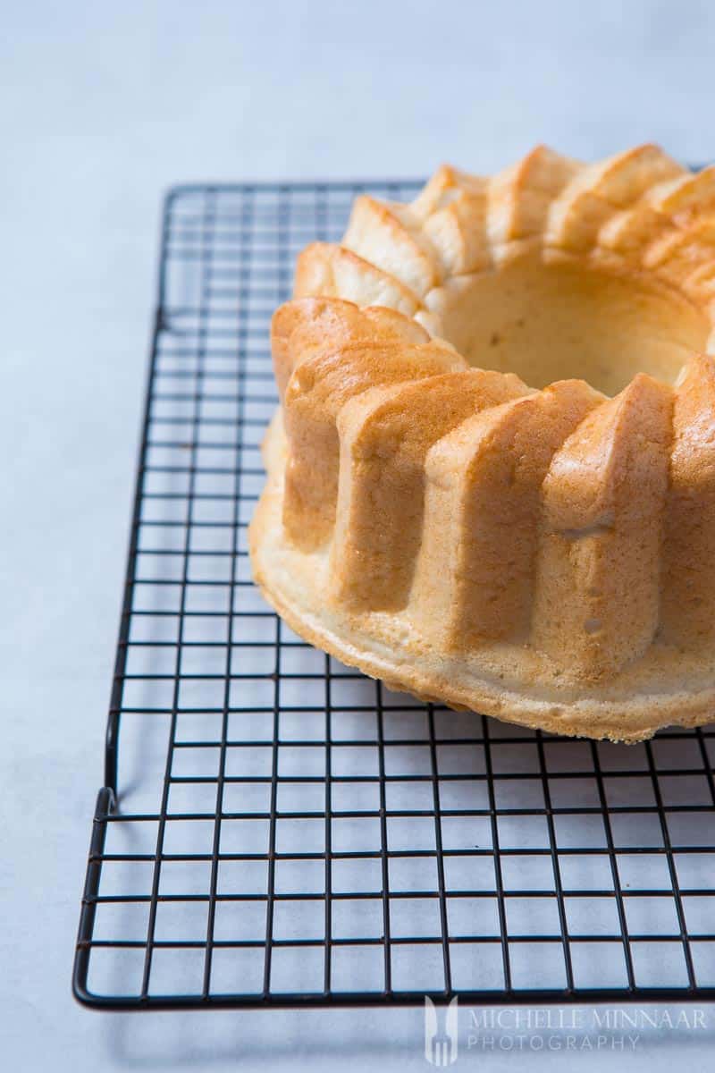A close up of the cake for sugar free angel food cake on a wire rack