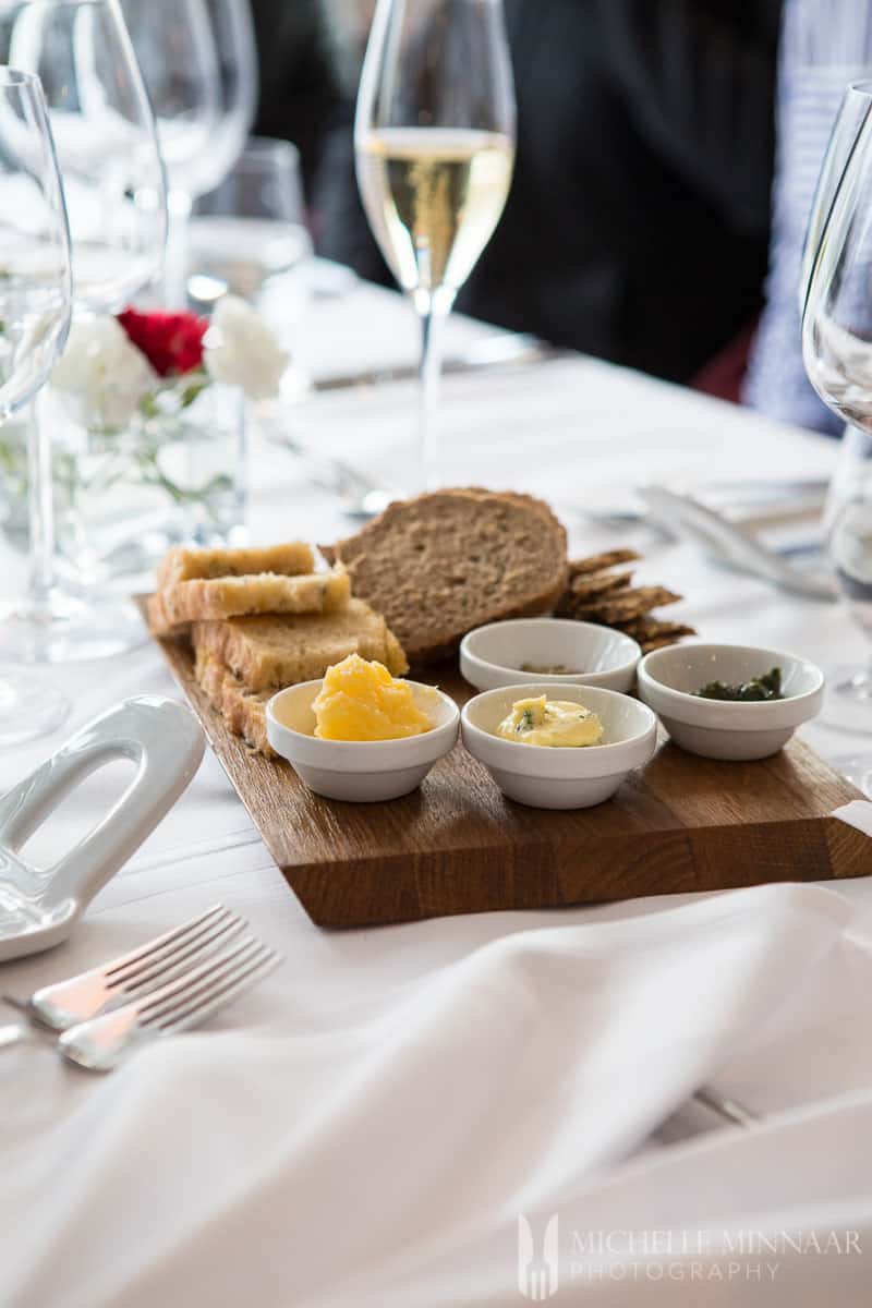 Bread and butter on a wooden board