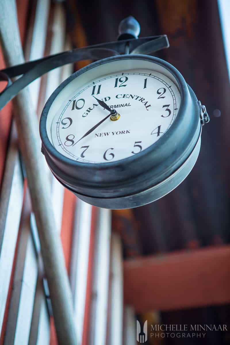 A close up of a round clock 
