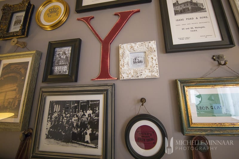 A wall of frames at Hotel Indigo 