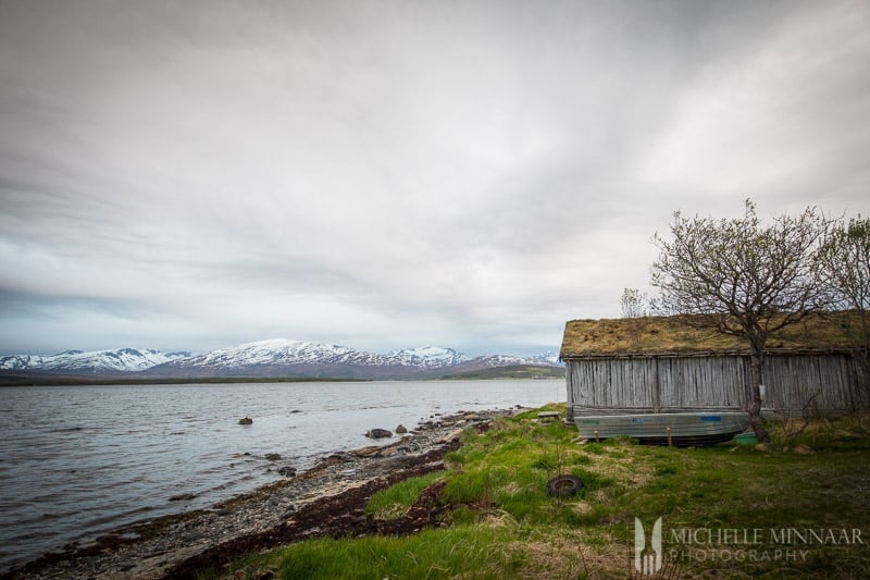 The coastline of Norway with a wooden house 