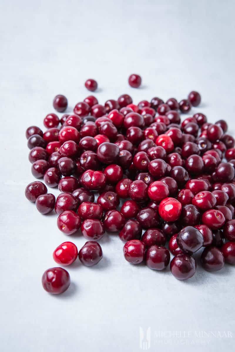 A large pile of fresh cherries to make cherry muffins