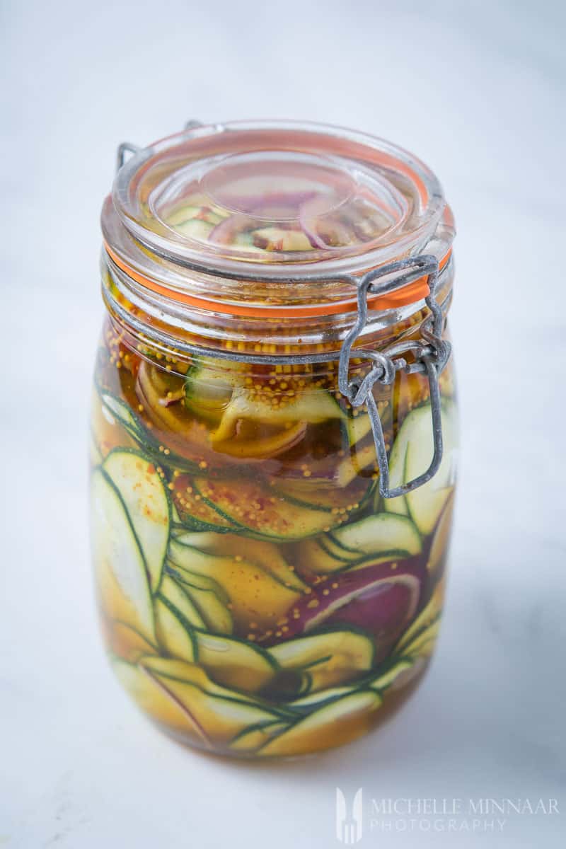 A closed glass jar of Courgette Pickle