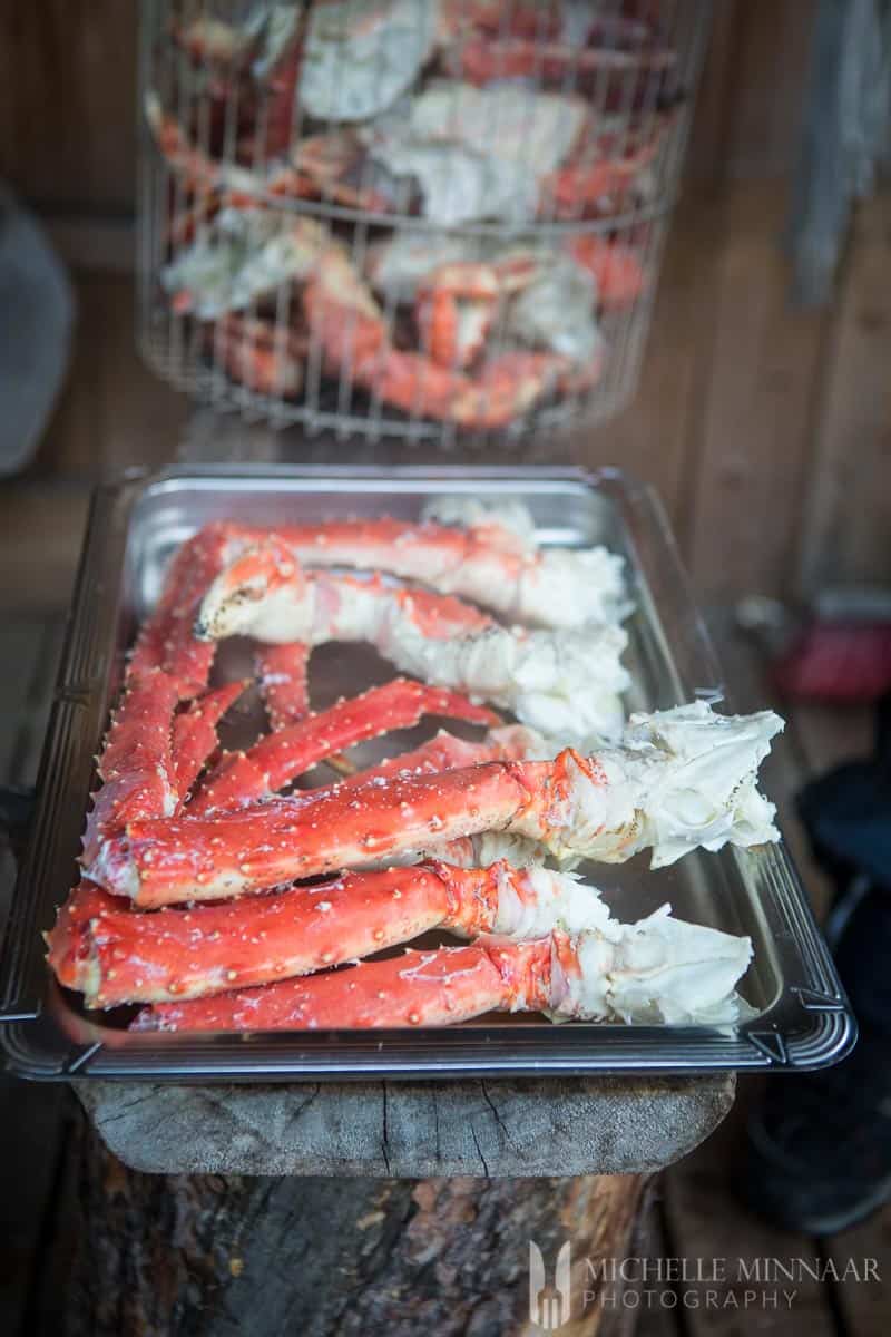 A close up view of the crab legs cooked in a sheet pan 