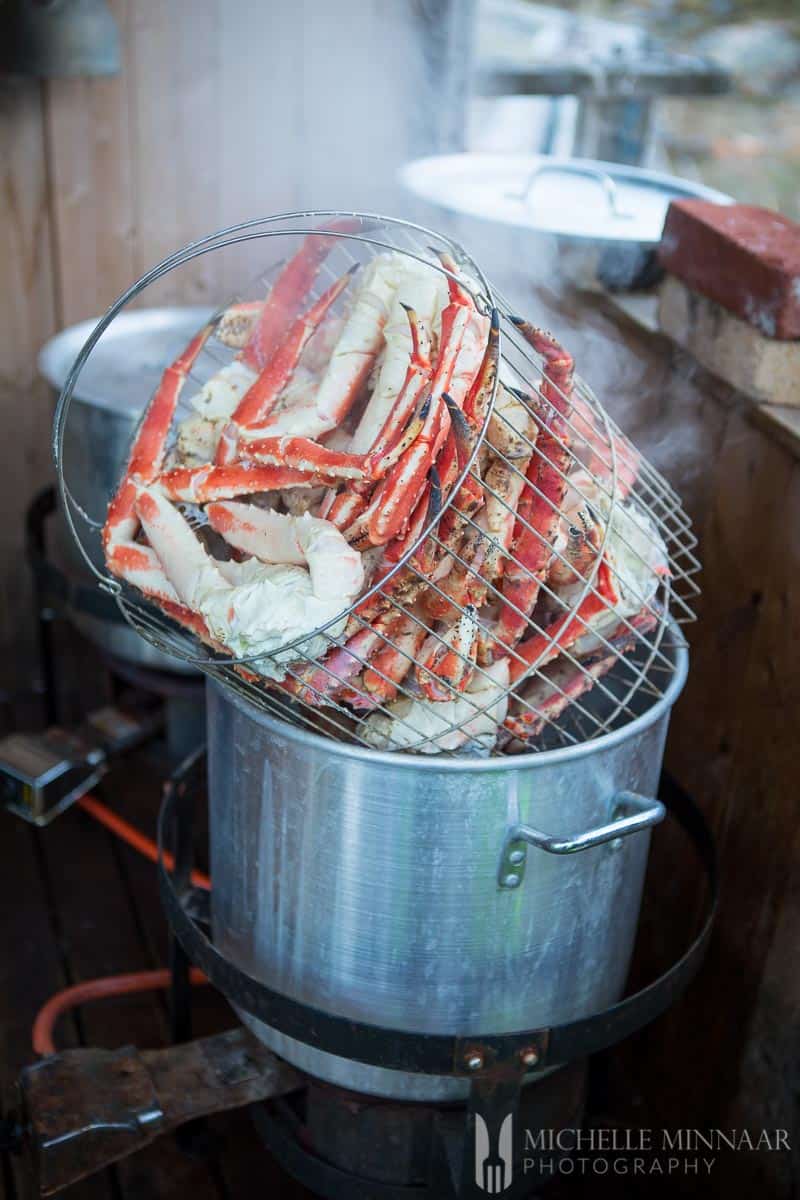 A basket full of steamed crab legs