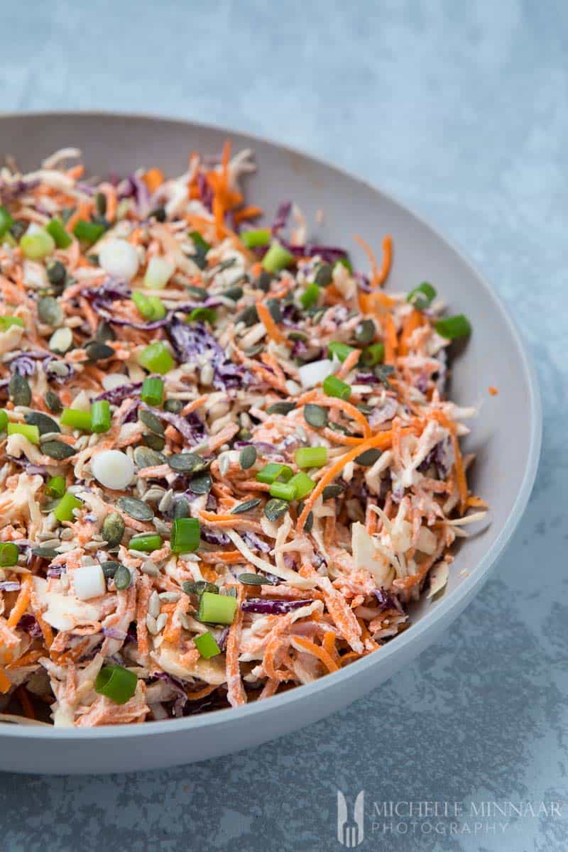  A bowl of vegan coleslaw: Pumpkin Seeds Law Carrot Cabbage