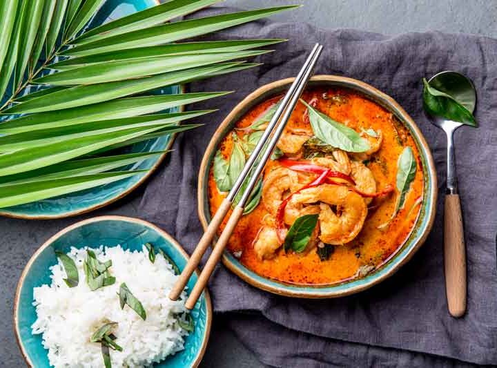 Full thai meal, white rice and red curry dish