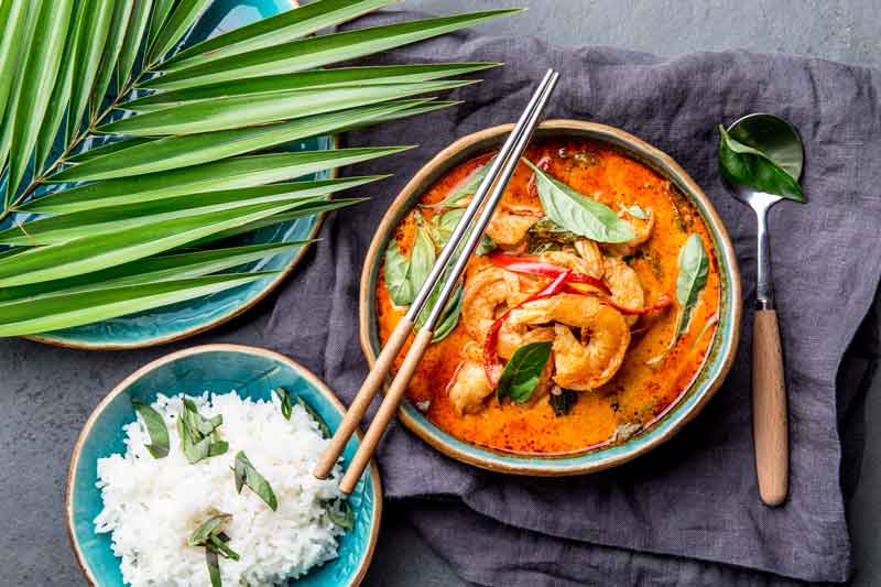 Full thai meal, white rice and red curry dish