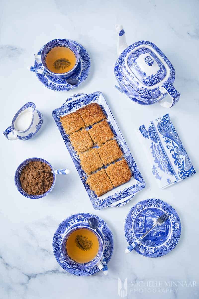 A plate of Sugar Free Flapjacks and tea set 