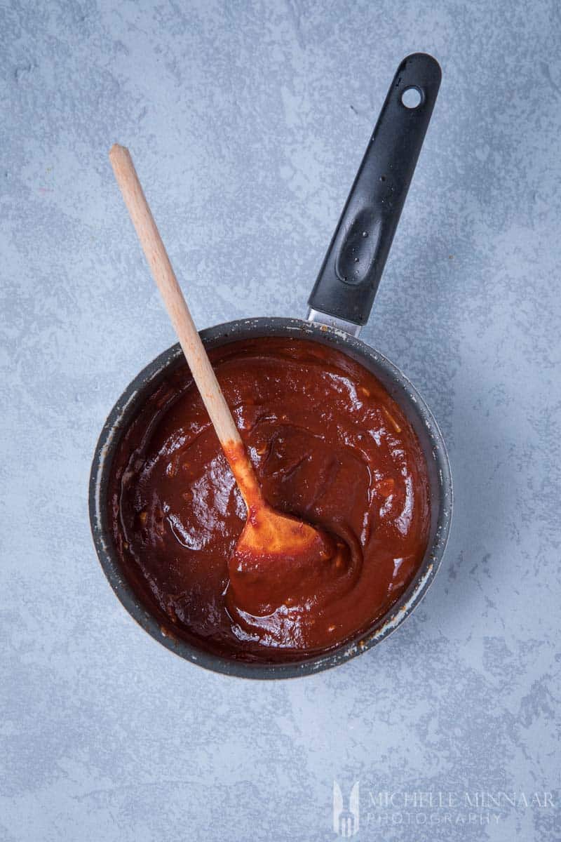 An aerial view of gluten free barbecue sauce in a sauce pan 