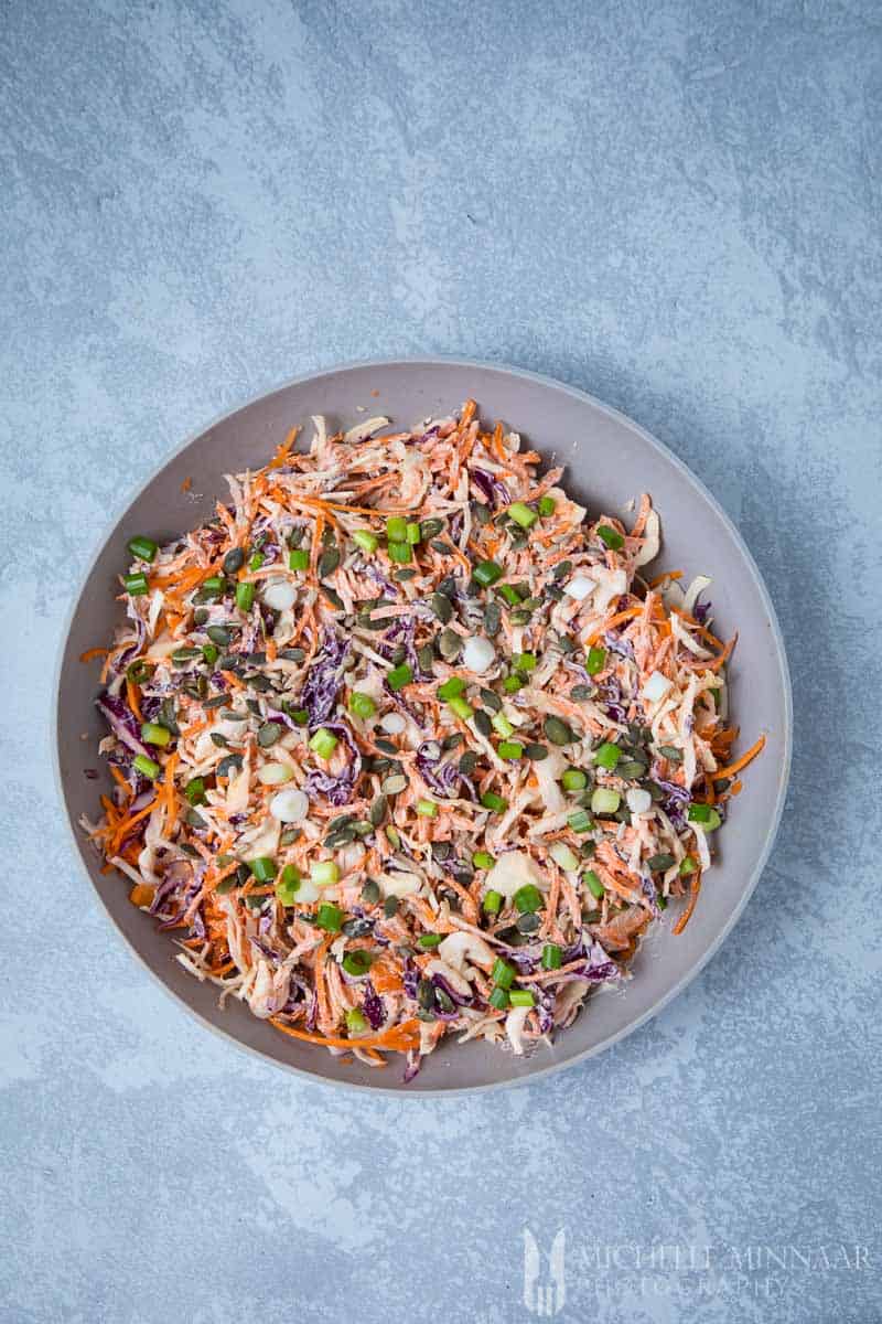 A bowl of colorful vegan coleslaw