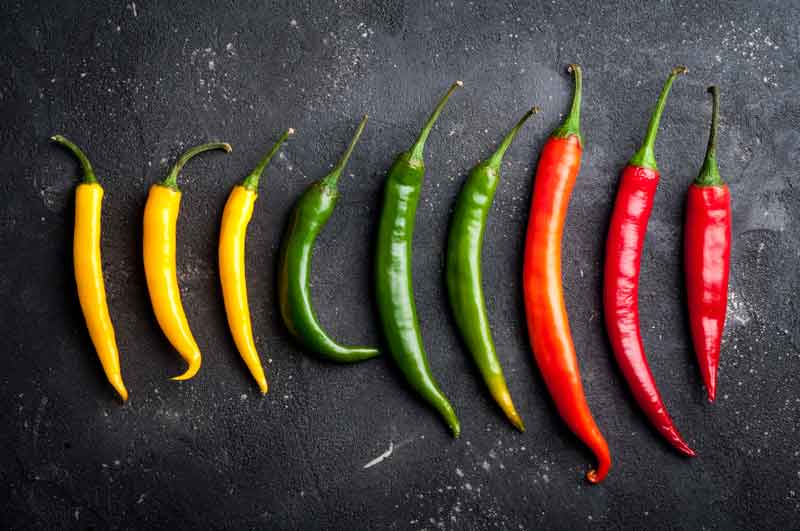 Skinny yellow, green and red chillies