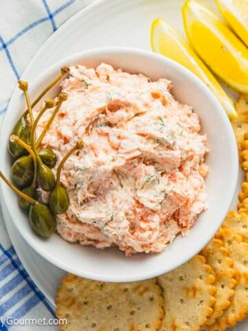 Smoked salmon pate in a bowl with olives.