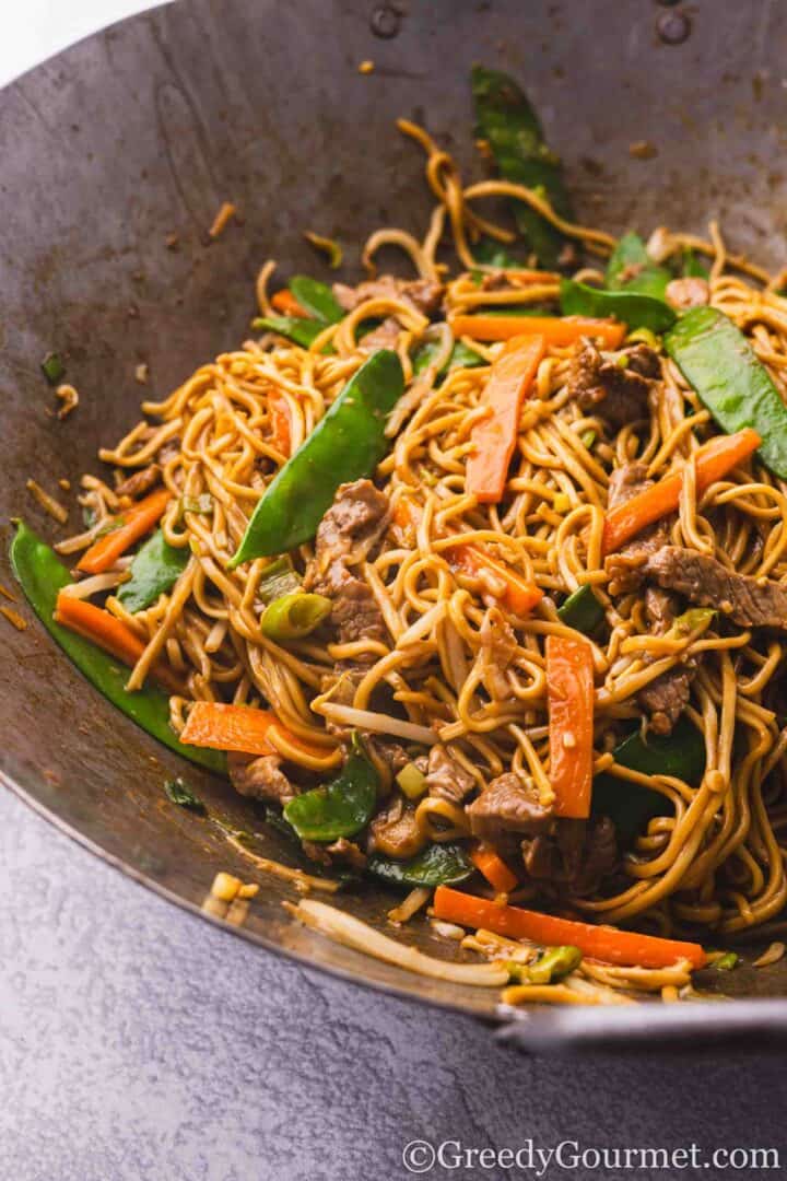 Beef chow mein in a wok.