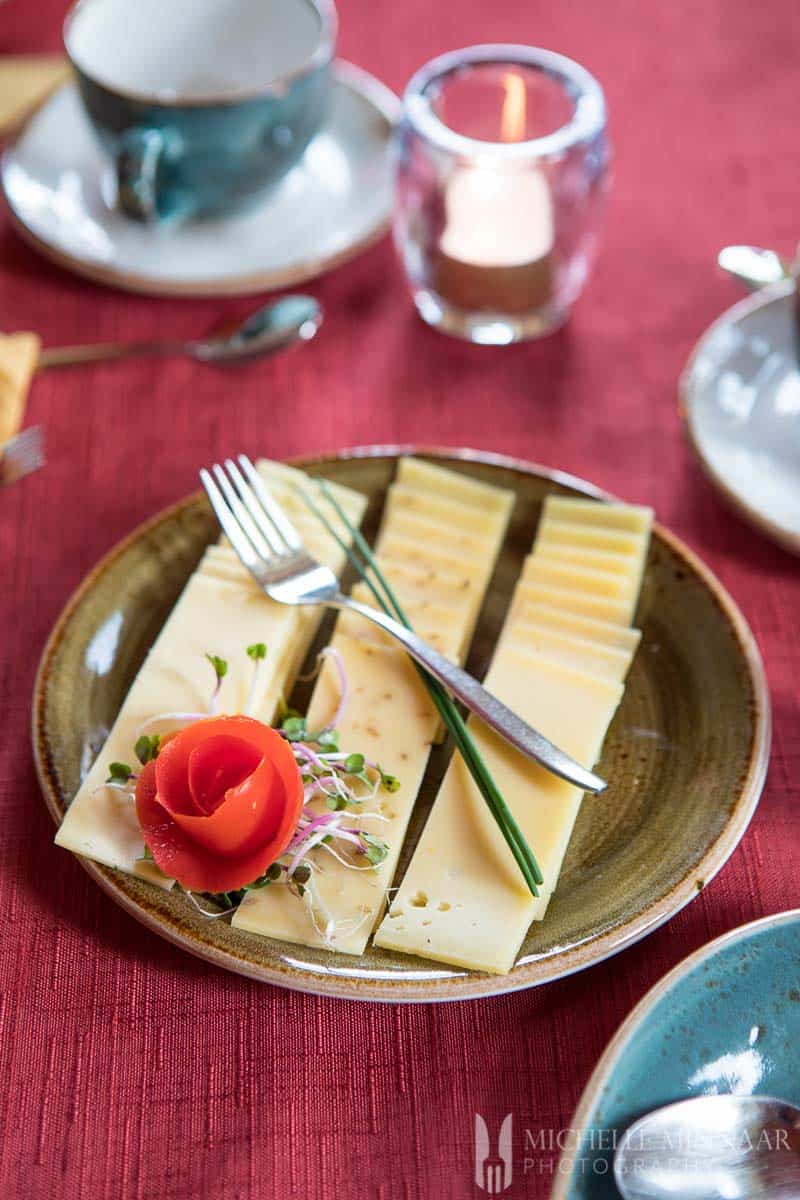 Slices of dutch cheese with a red rose on top 