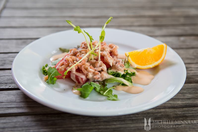 Prawn Watermelon Salad - endive, watermelon and prawns on a plate