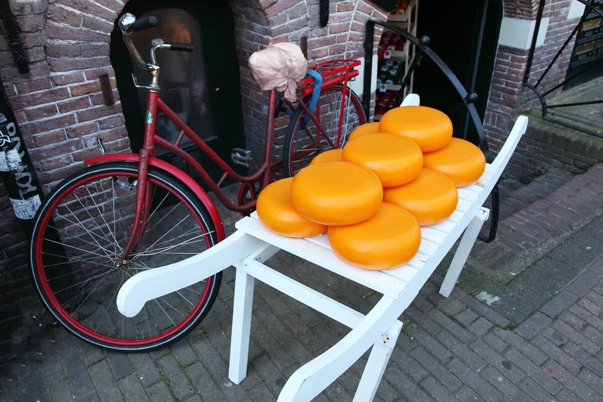 Circles of Edam cheese on a cart.