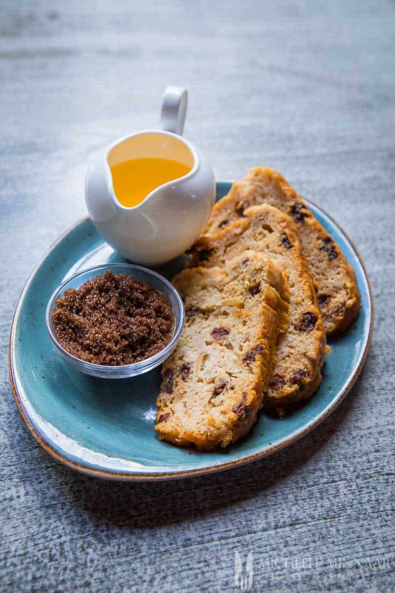 Slices of raisin bread called poffert with some melted butter