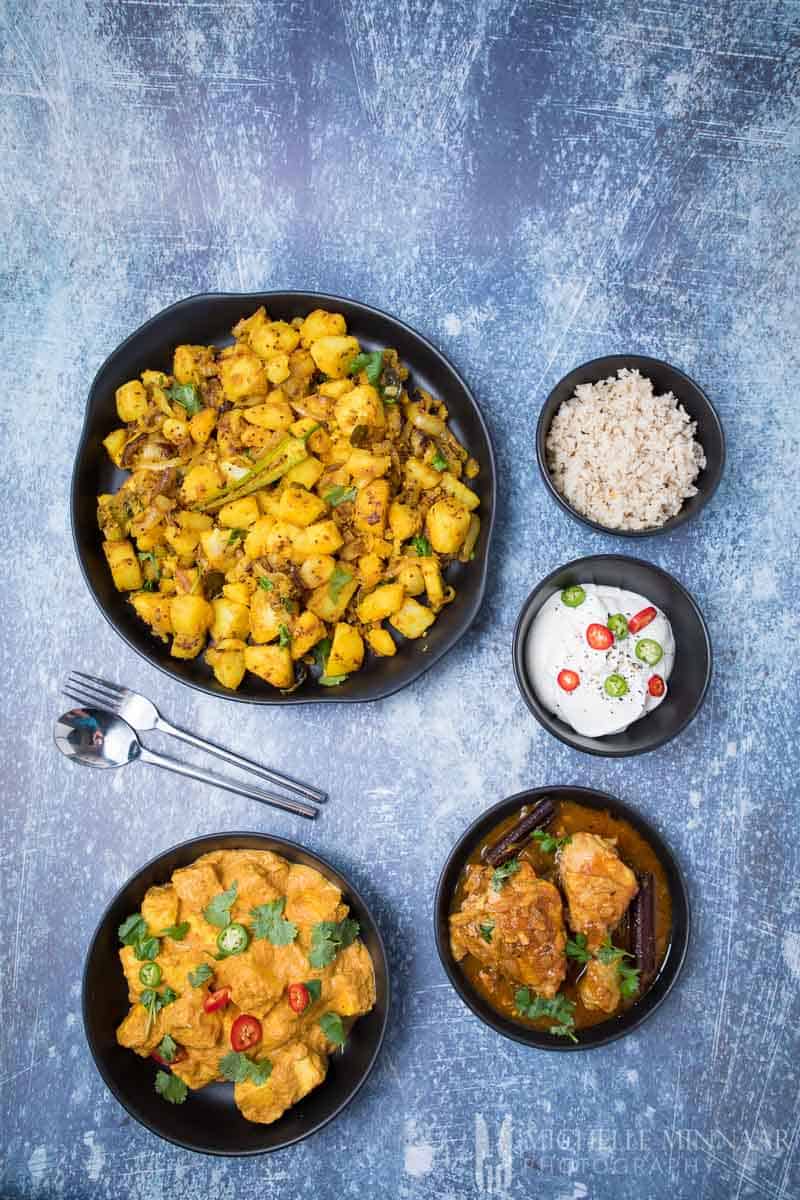 A full Indian dinner, paneer korma, aloo, chicken and rice 