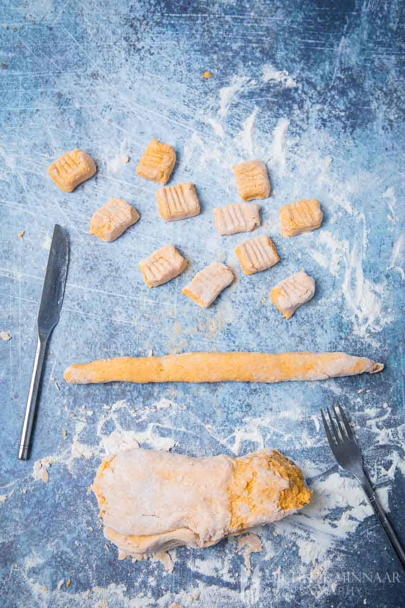 Raw orange pasta dough on a counter