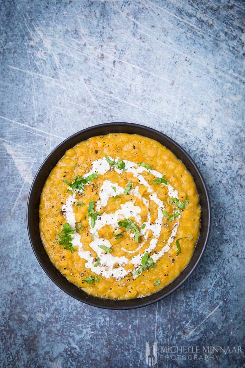 A yellow bowl of Vegan Split Pea Soup