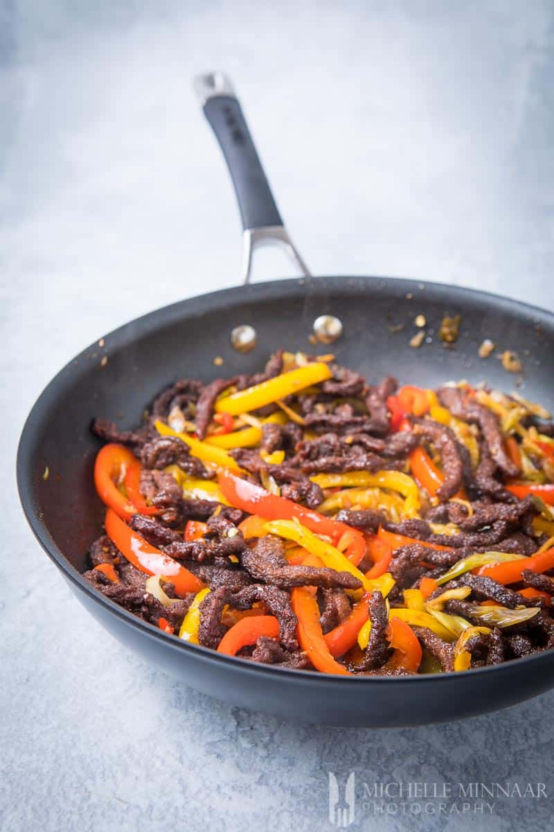 crispy chilli beef in a skillet 