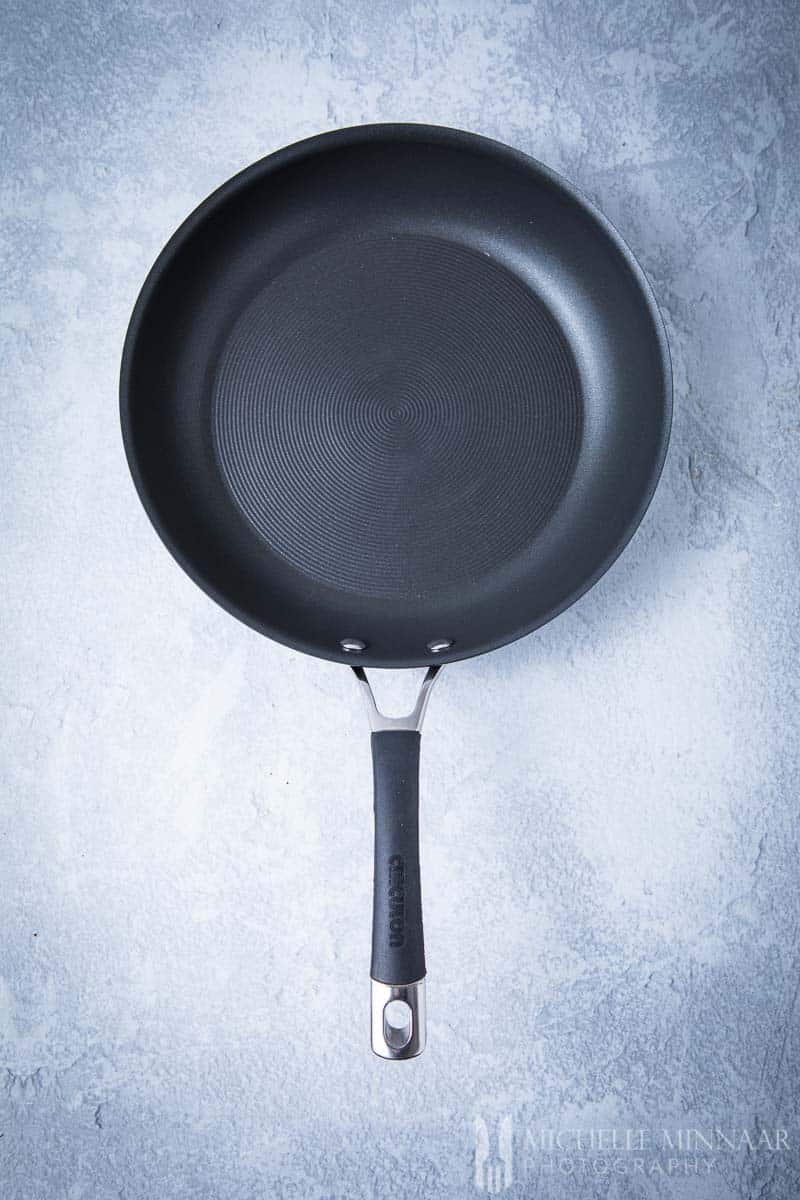 A black Circulon skillet with a black handle