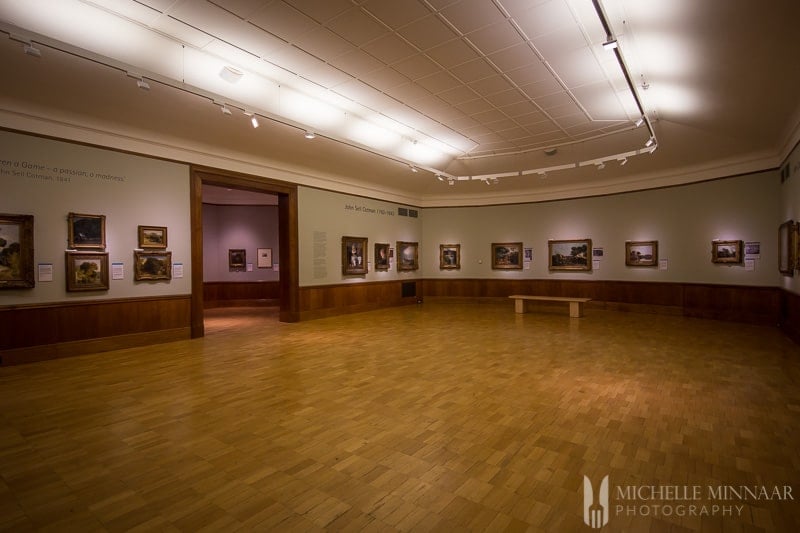 Art Collection in a room with a wooden floor 
