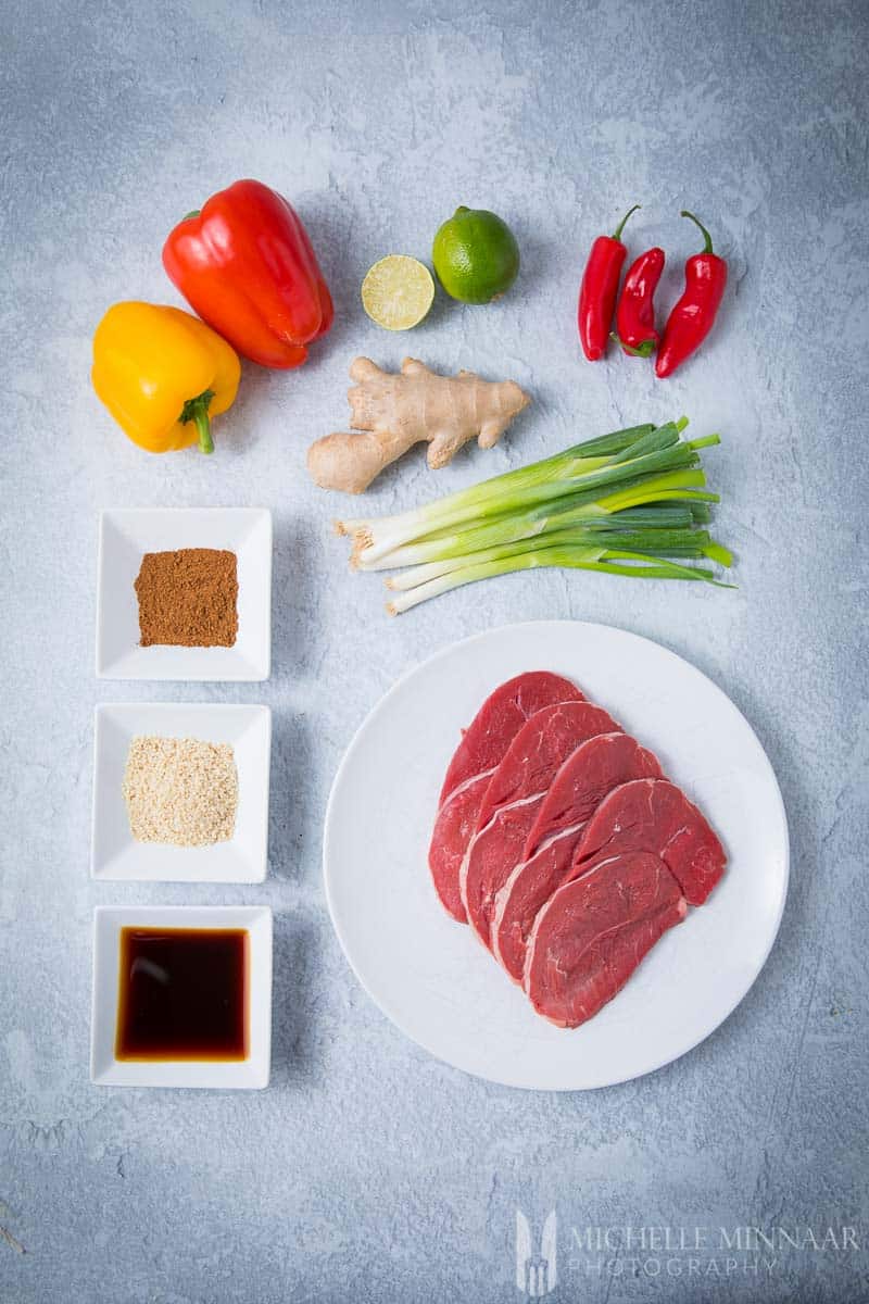 Ingredients for crispy chilli beef: Ginger Onion Soy Spices Steak Pepper Slime