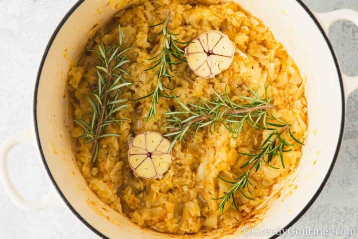 Add garlic rosemary to pan of onion.