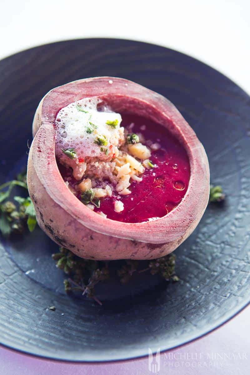 A purple beet filled with sea foam 