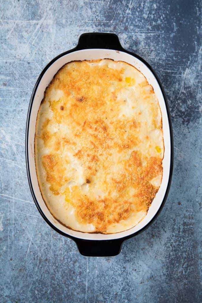 cod au gratin in a white dish