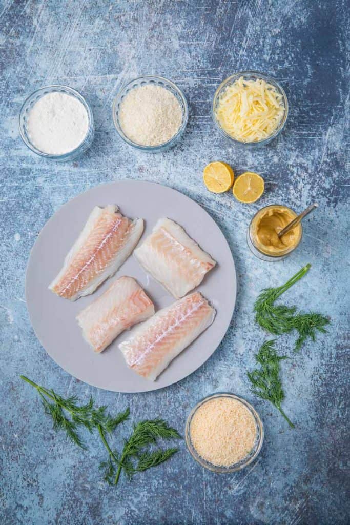 Ingredients for cod au gratin : raw fish, cheese, mustard