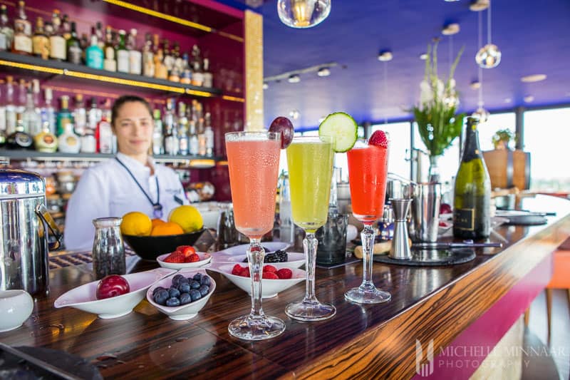 Three colorful cocktails on the bar 