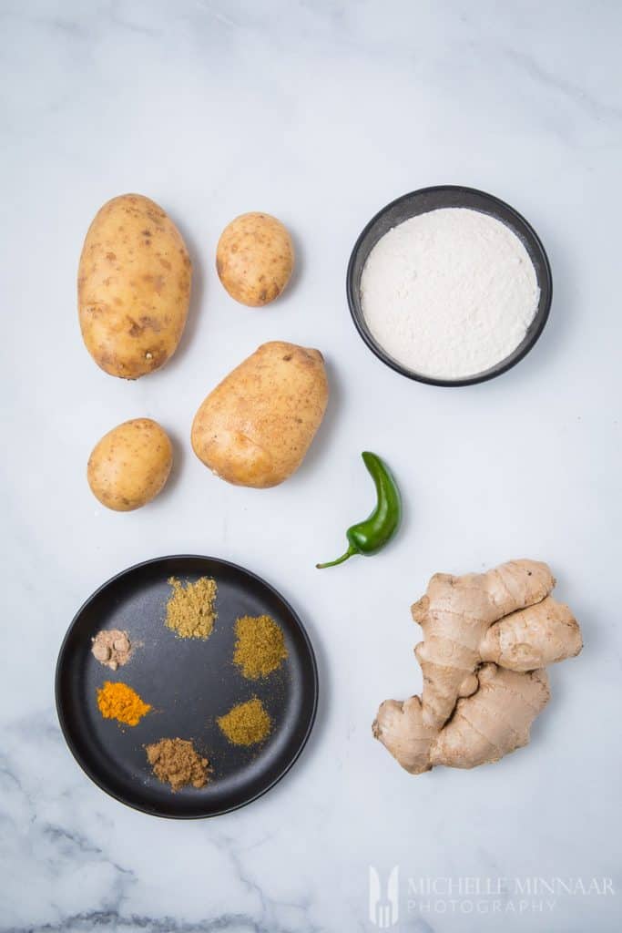 Ingredients for aloo ki kachori: Ginger Chilli Potato Flour Spices