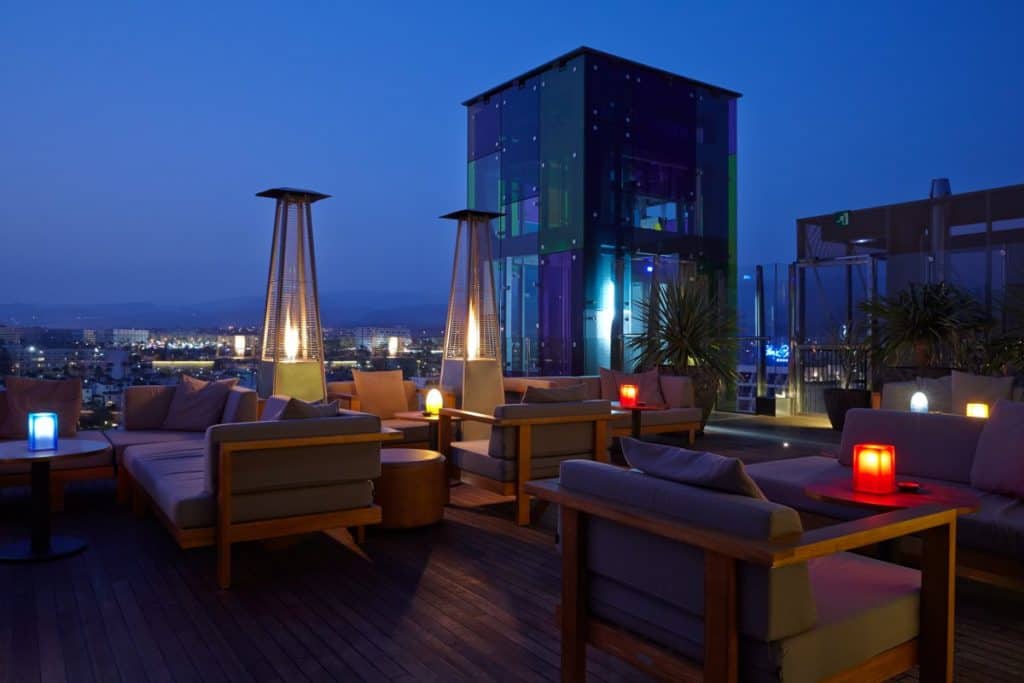 A fancy rooftop bar at nighttime
