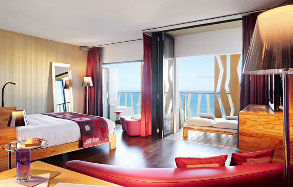 The bedroom at the hotel, red and tan coloring