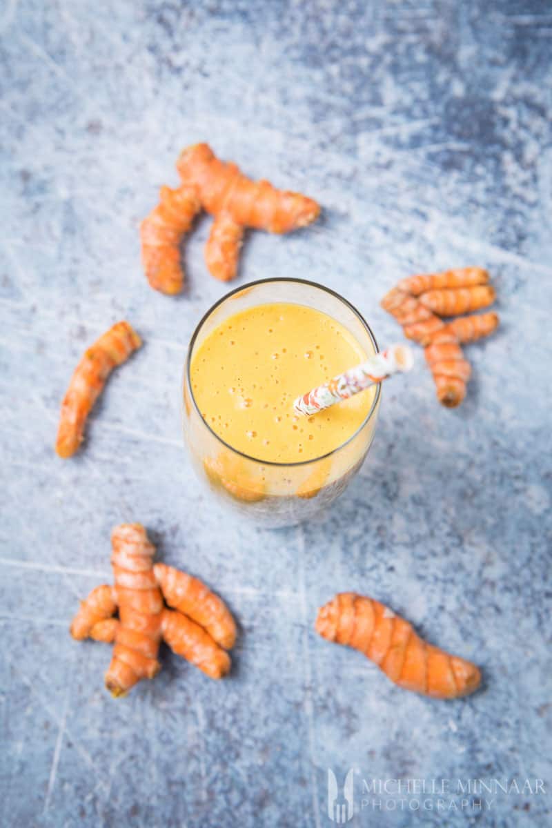 An aerial view of a Turmeric Smoothie with raw turmeric 