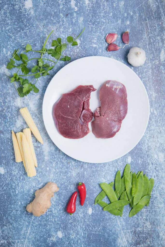 Ingredients for venison stir fry, raw venison, corn, snap peas 