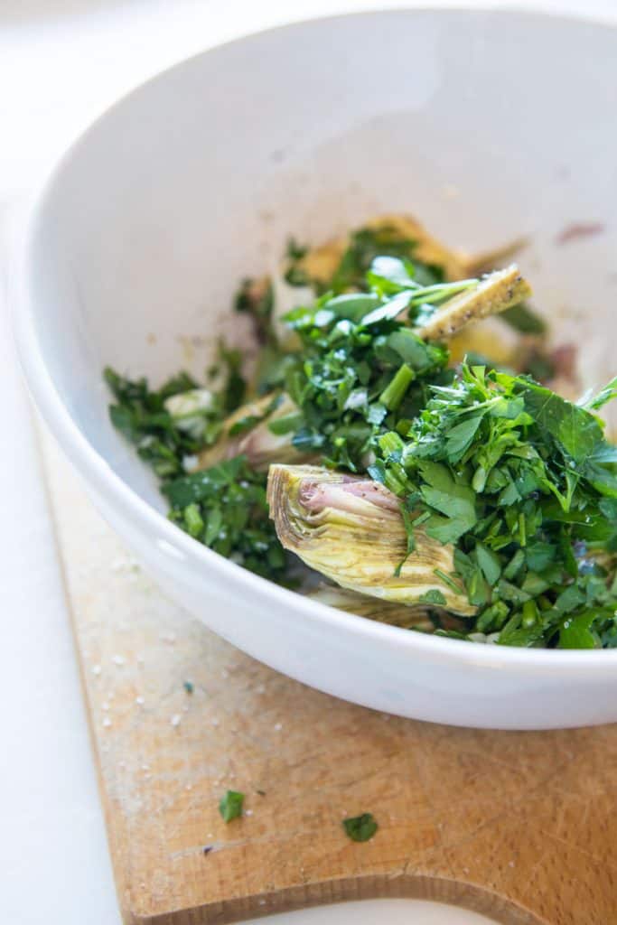Artichoke Hearts and greens in a bowl 