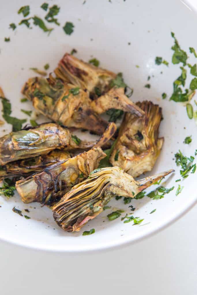 A close up of roasted artichoke hearts