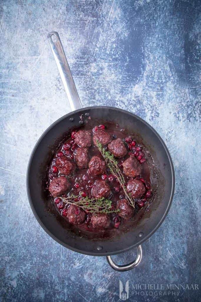 venison meatballs in a saute pan 