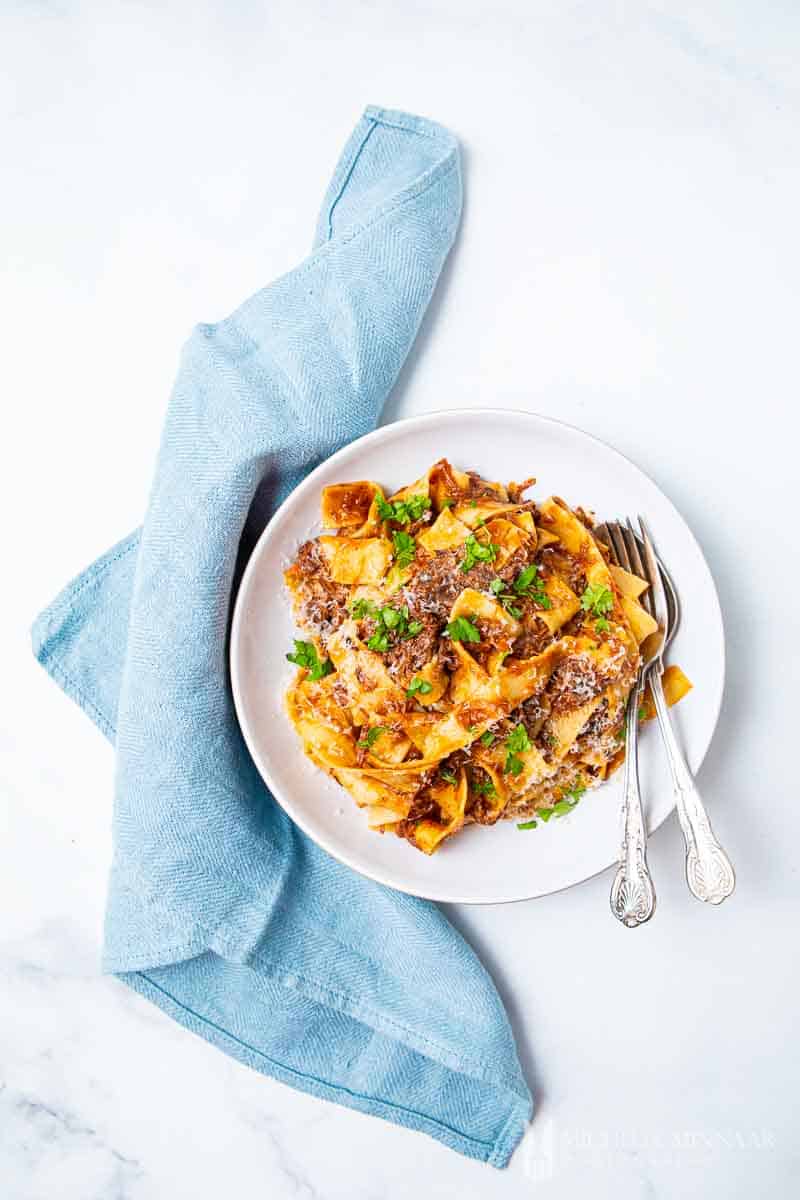 Plate of pasta and sauce to make Beef Cheek Ragu