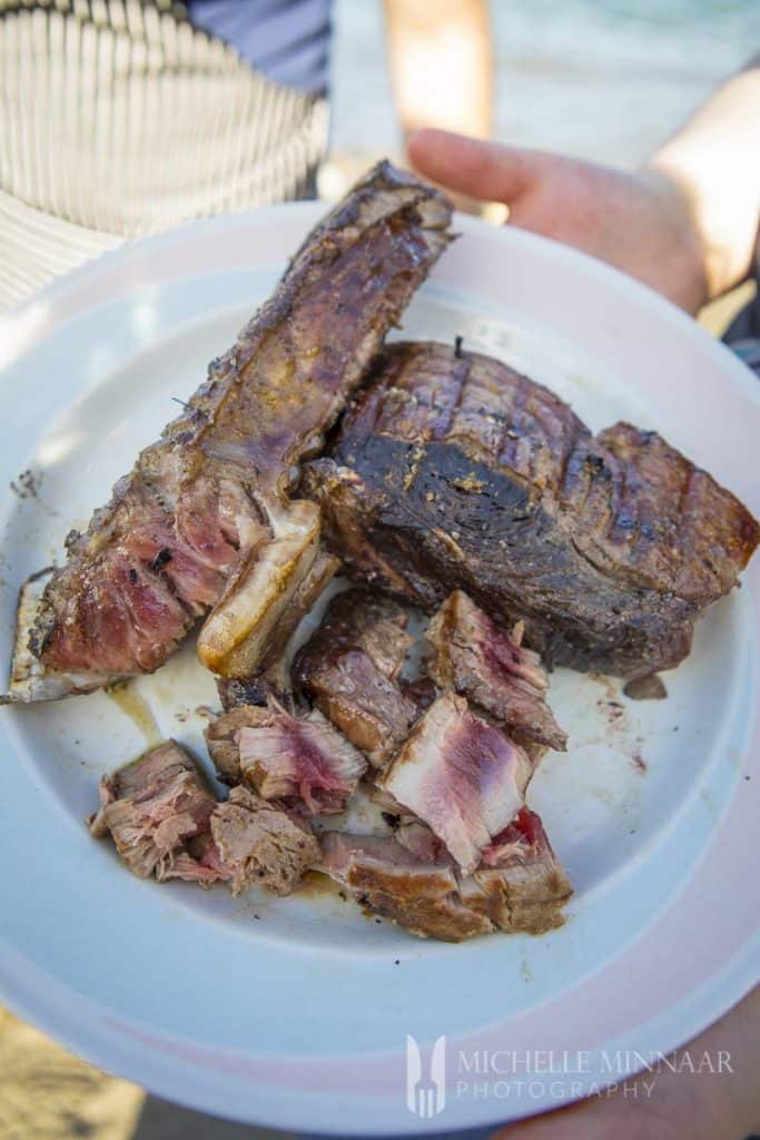A plate of barbequed tuna steaks 