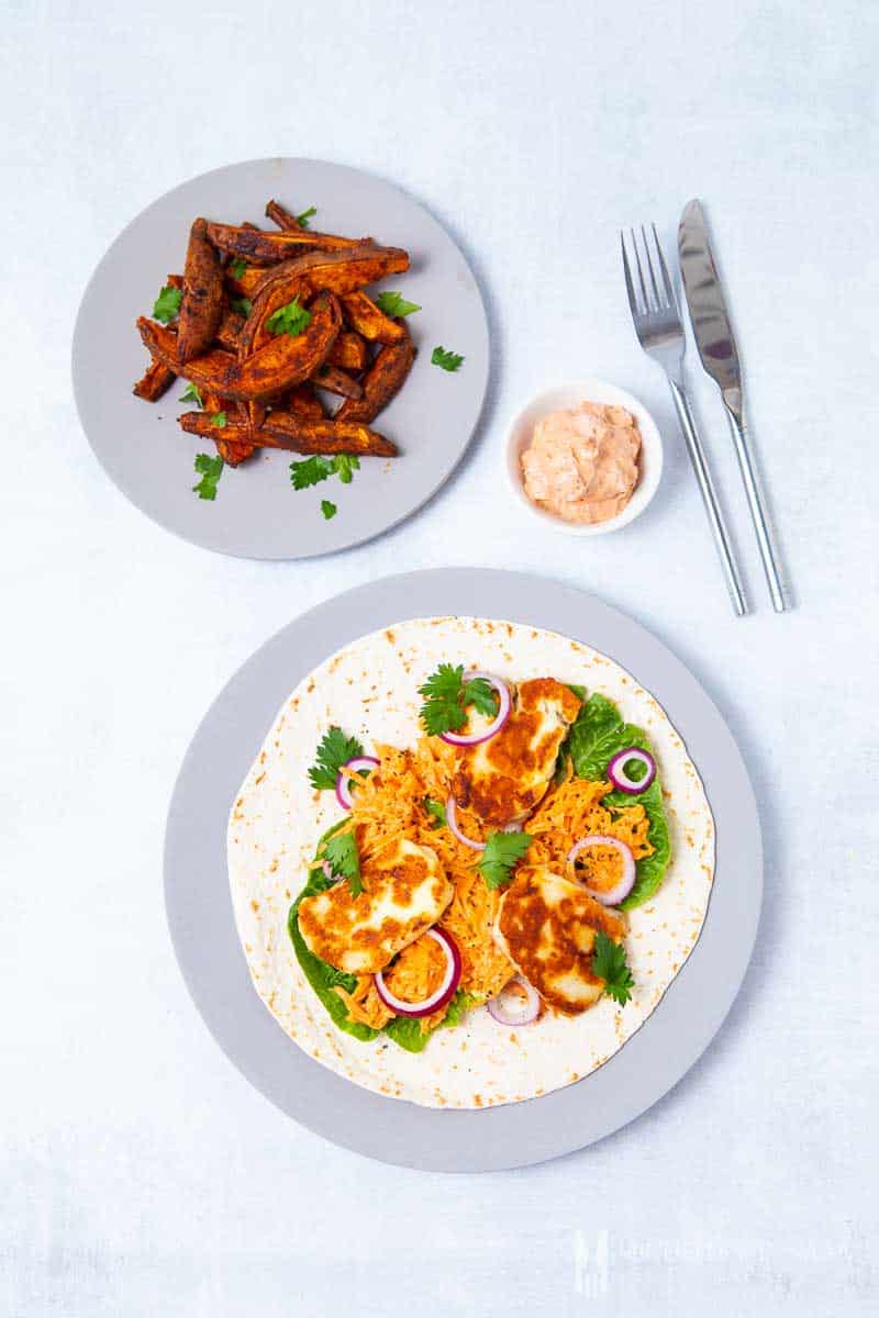 A plate of halloumi wraps with a side of fries