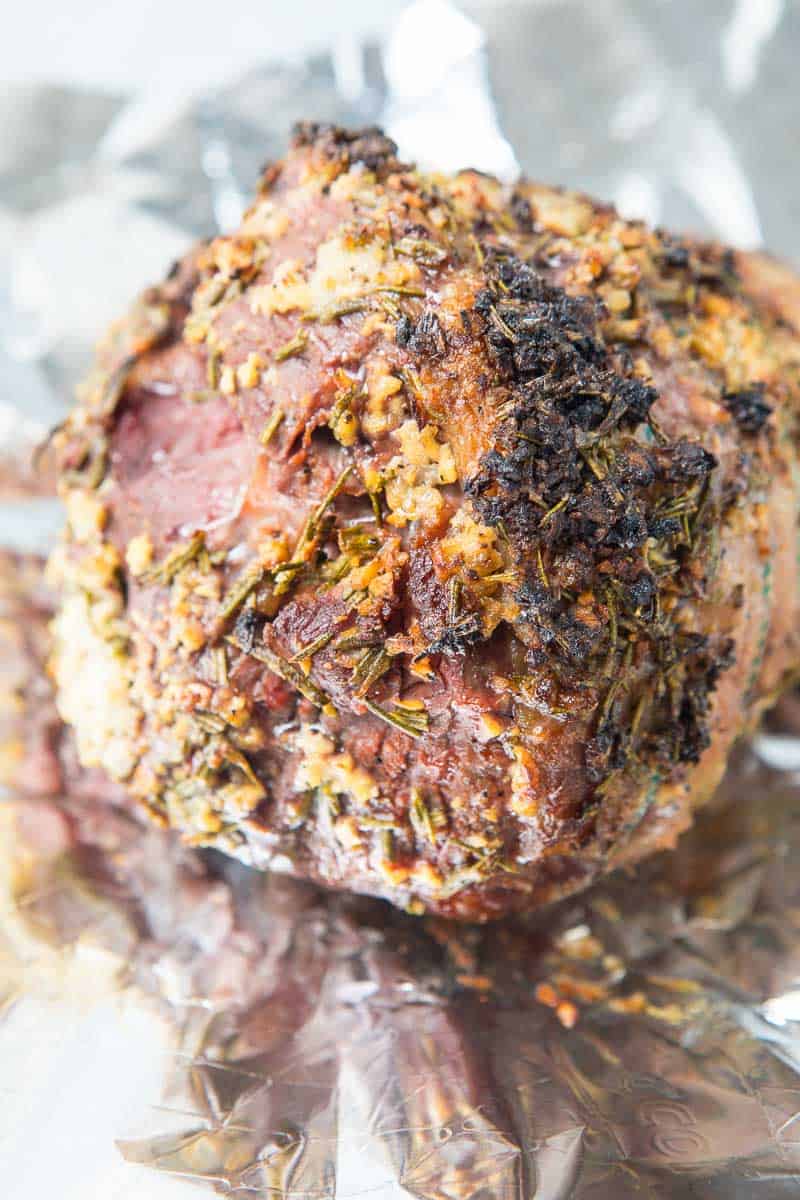 A close up of a smoked leg of lamb